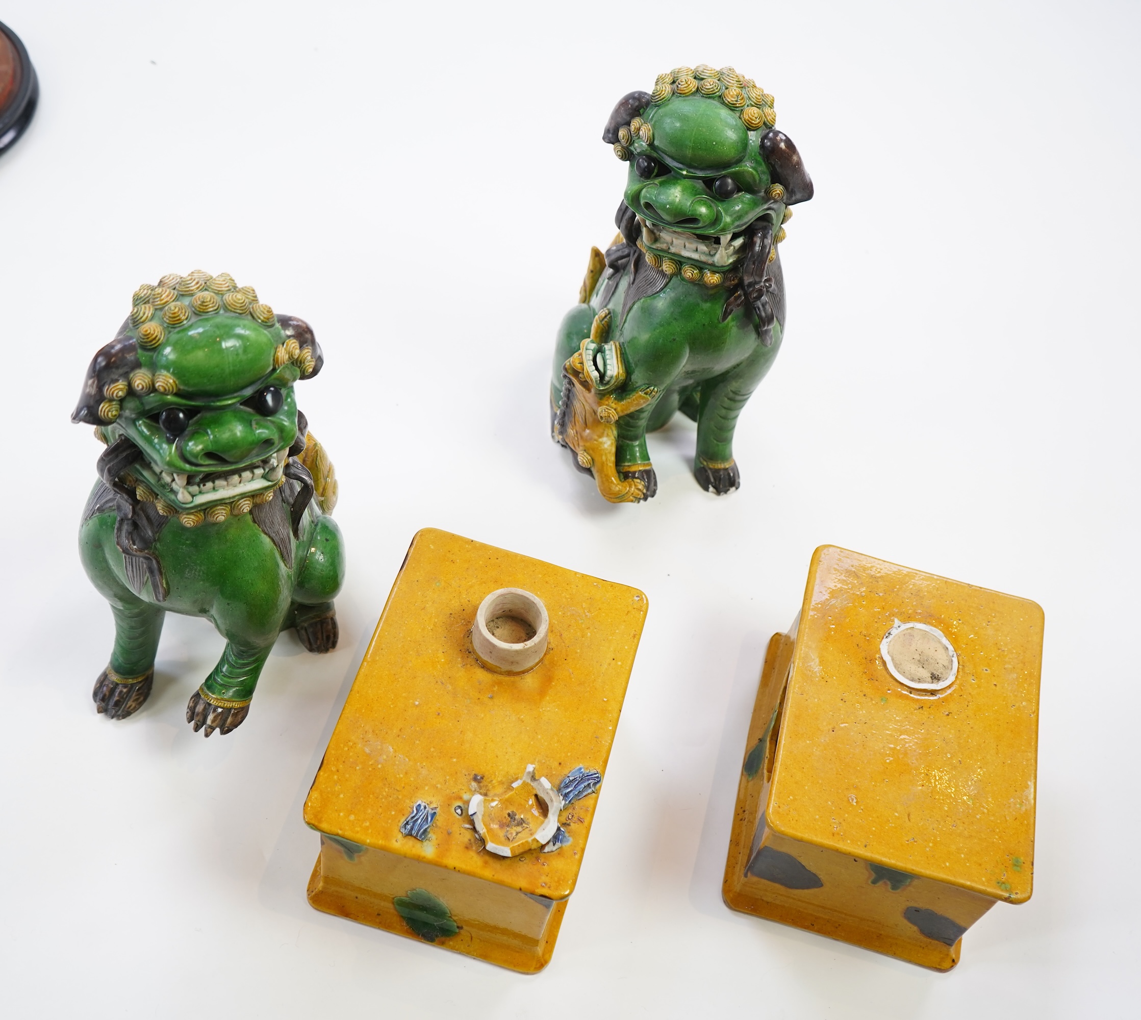 A pair of large Chinese sancai-glazed biscuit figures of Buddhist temple lions, 19th century